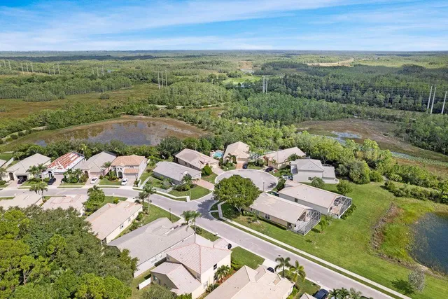 an aerial view of a house with a lake view