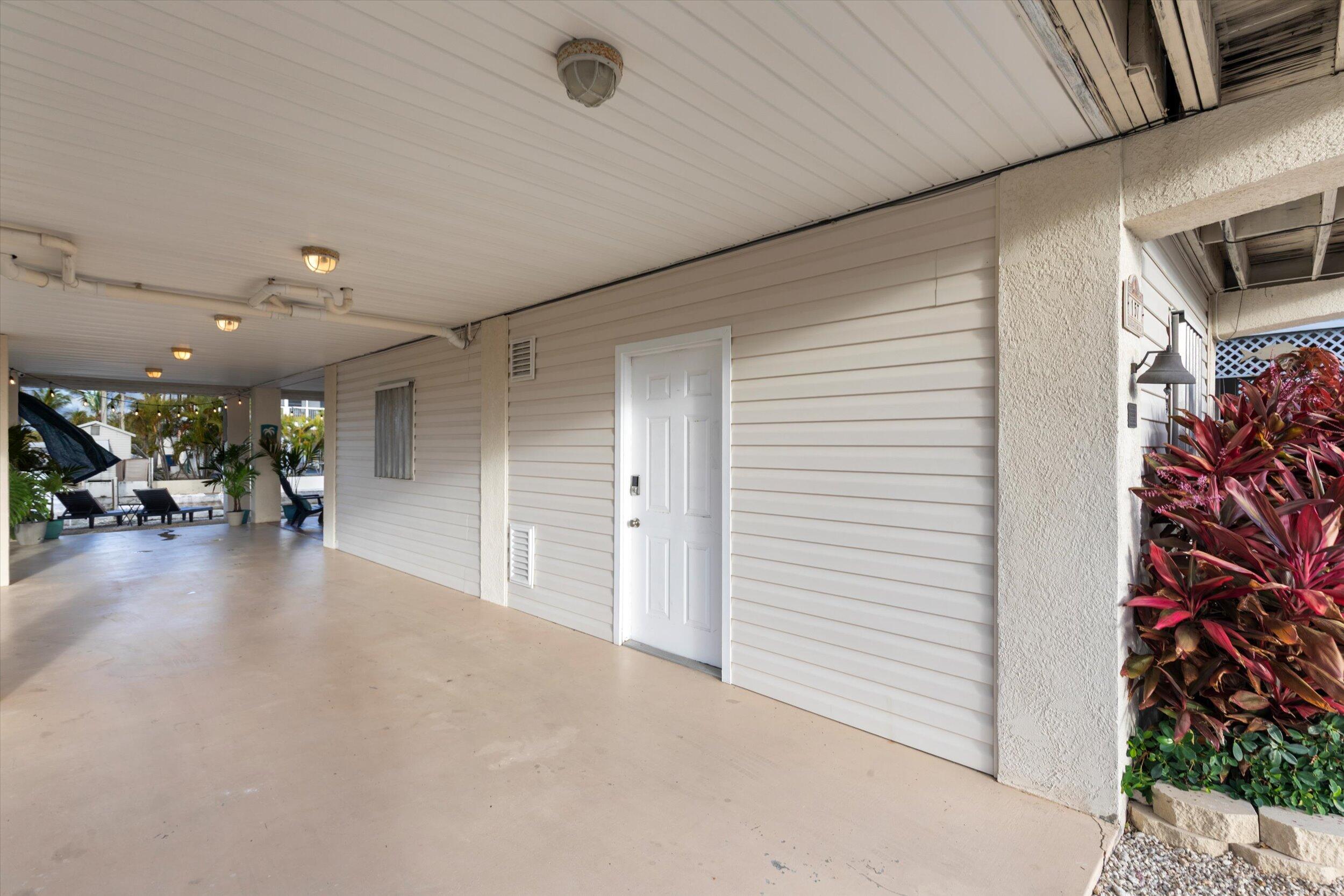 157 Mars Lane Key West, FL 33040 - Photo 35 of 41 a view of a livingroom with furniture and a garage