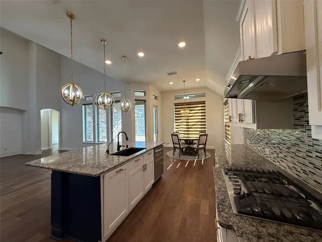 a kitchen with counter top space and appliances