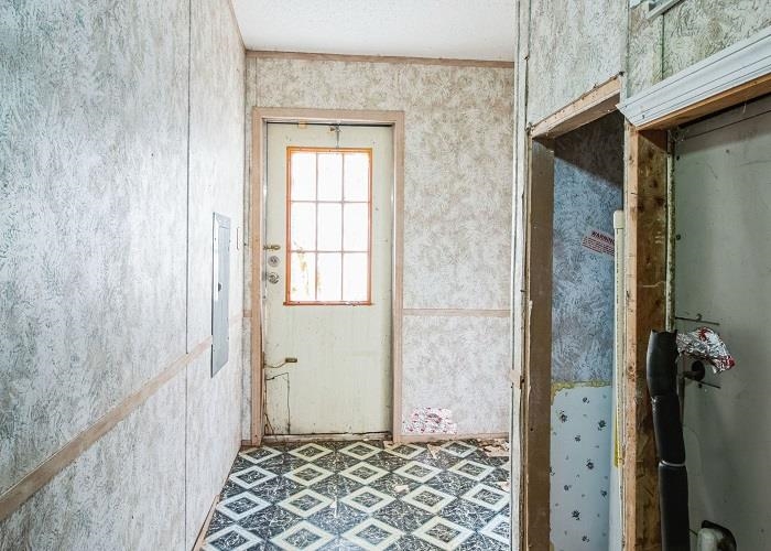 4414 Covey Hollow Road Culleoka, TN 38451 - Photo 14 of 16 a view of a hallway with wooden floor and a bathroom
