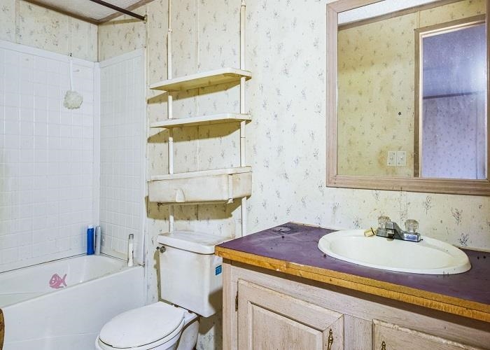 4414 Covey Hollow Road Culleoka, TN 38451 - Photo 15 of 16 a bathroom with a sink and a mirror