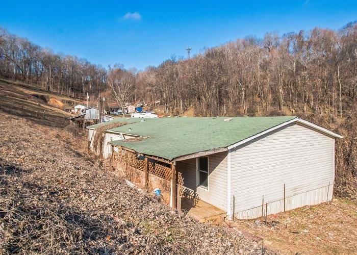 4414 Covey Hollow Road Culleoka, TN 38451 - Photo 2 of 16 a view of house with trees in the background
