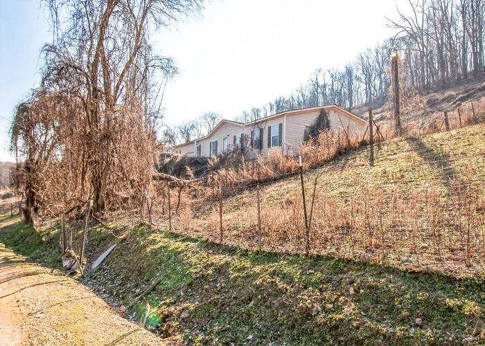 4414 Covey Hollow Road Culleoka, TN 38451 - Photo 4 of 16 a view of a house with a yard