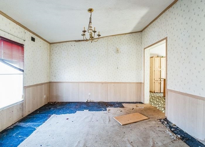 4414 Covey Hollow Road Culleoka, TN 38451 - Photo 5 of 16 a view of an empty room with wooden floor and a window