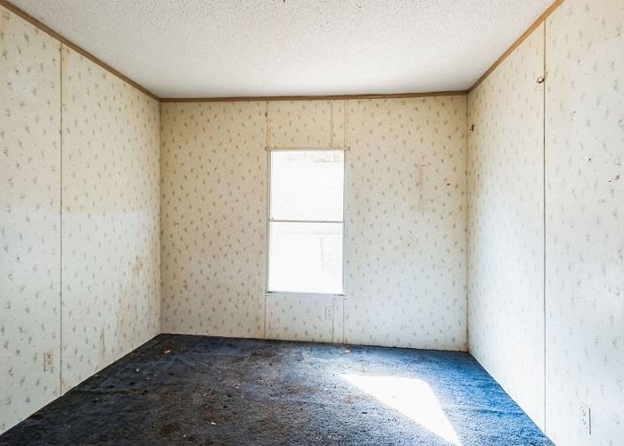4414 Covey Hollow Road Culleoka, TN 38451 - Photo 9 of 16 an empty room with wooden floor and windows