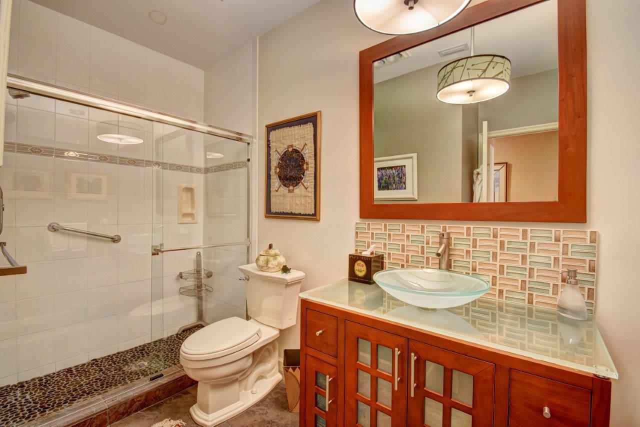 6528 Via Rosa Boca Raton, FL 33433 - Photo 13 of 22 a bathroom with a sink a toilet and shower