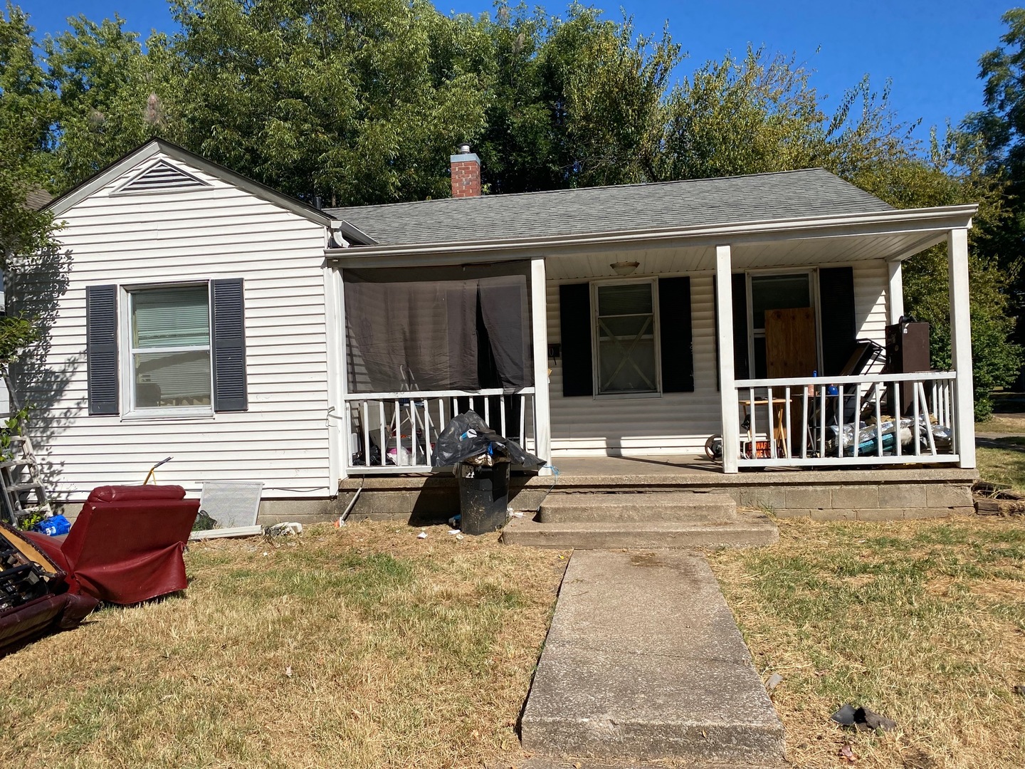 a view of a house with a barbeque and wooden floor