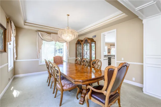 a kitchen with stainless steel appliances granite countertop a sink and a refrigerator