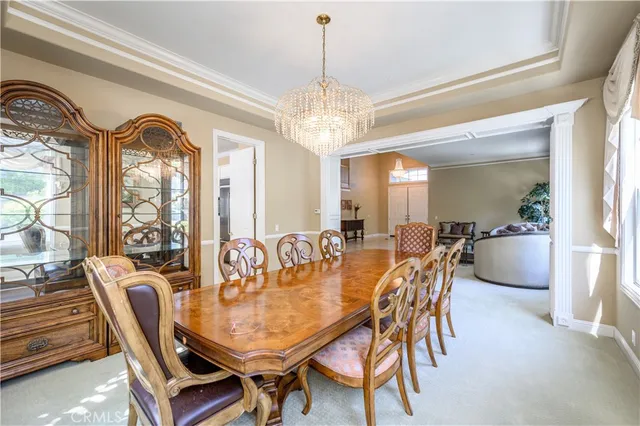 a large kitchen with granite countertop a sink a window and stainless steel appliances