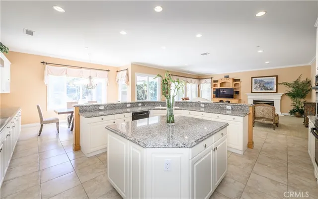 a large kitchen with granite countertop lots of counter top space