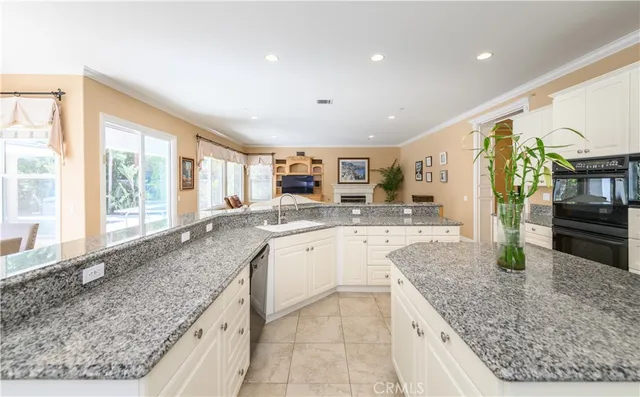a large kitchen with a table and chairs in it