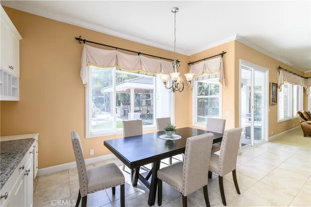 a large kitchen with granite countertop a large counter top stainless steel appliances and cabinets