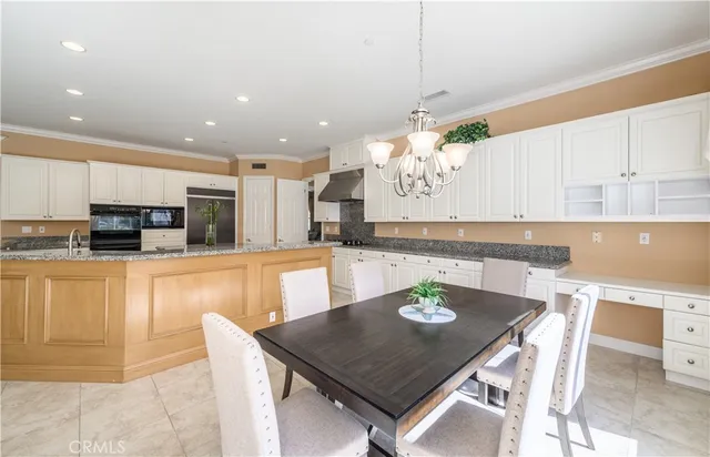 a living room with furniture large window and a fireplace