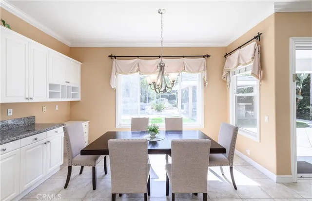 a view of living room kitchen with furniture and a potted plant