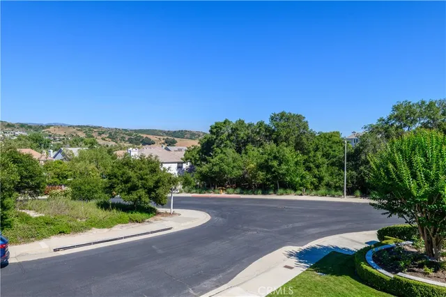 a bathroom with a bathtub and mirror