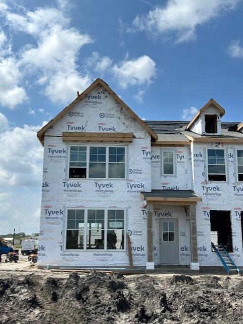 1609 Parkside Lane, Unit H Dyer, IN 46311 - Photo 1 of 2 a front view of a house with a yard