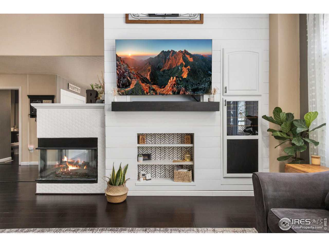 1808 Rolling Gate Road Fort Collins, CO 80526 - Photo 9 of 39 3-Sided Fireplace w/ Shiplap Wall