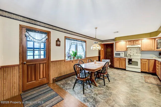 a bed room with a bed and a chandelier
