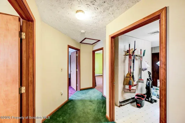 a view of a livingroom with wooden floor and closet area