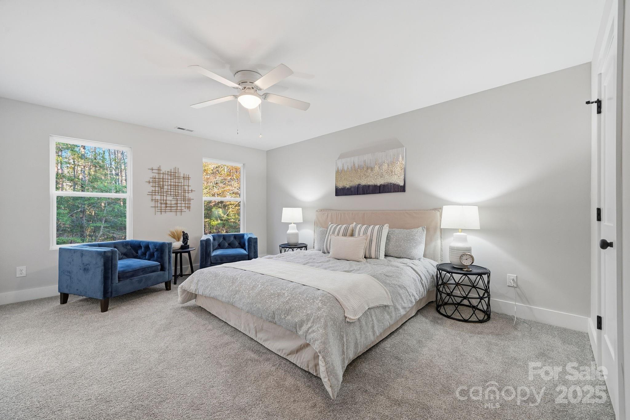285 Mainsail Road Salisbury, NC 28146 - Photo 20 of 41 a bedroom with a bed and a chandelier