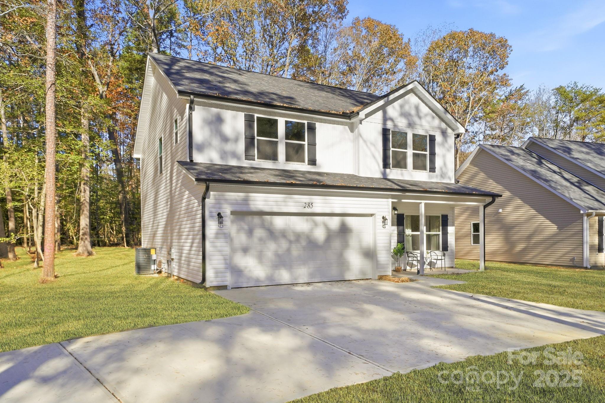 285 Mainsail Road Salisbury, NC 28146 - Photo 2 of 41 a view of a white house with a yard
