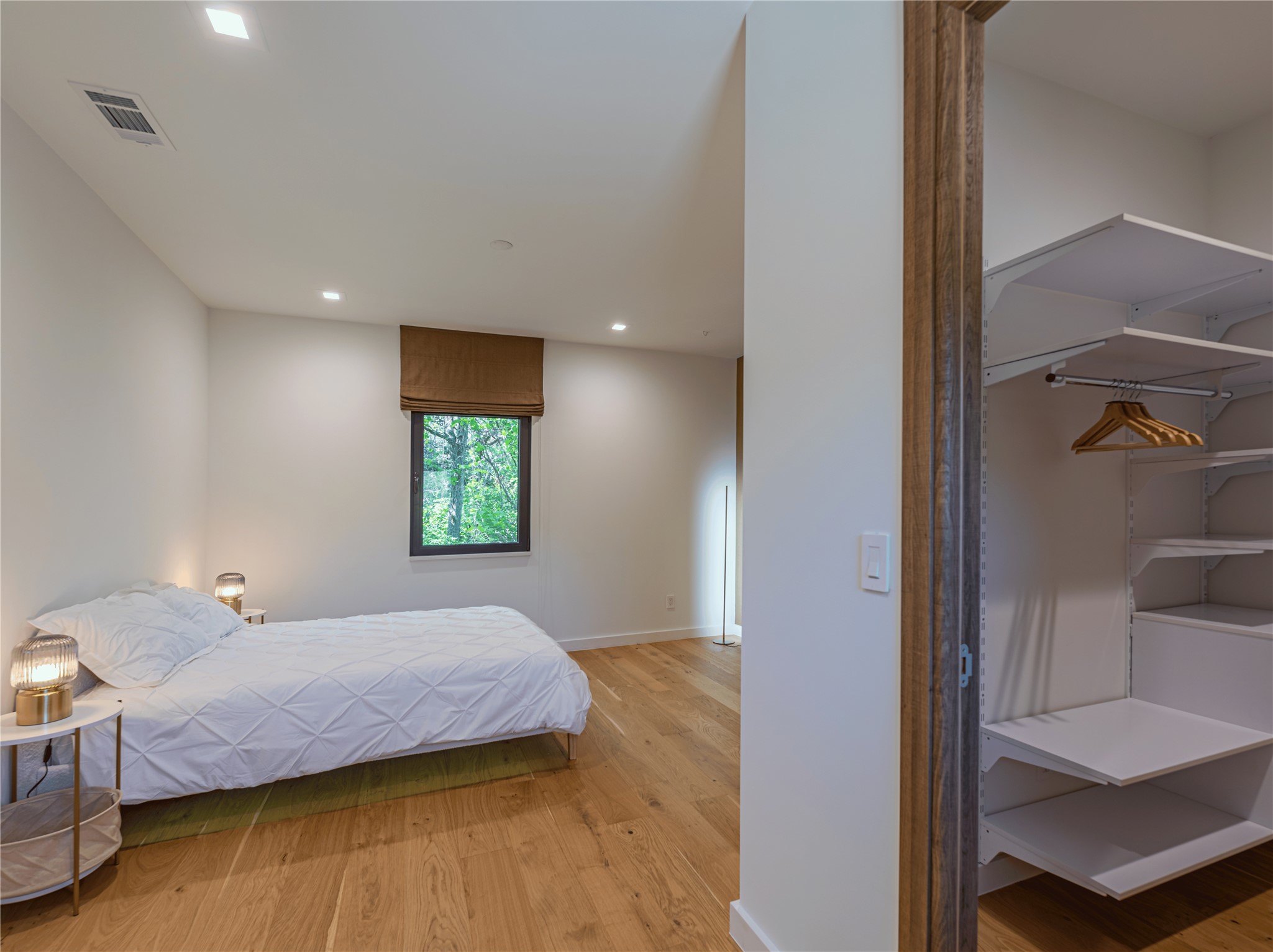2806 Geronimo Trail Austin, TX 78734 - Photo 21 of 36 a bedroom with a bed and a window