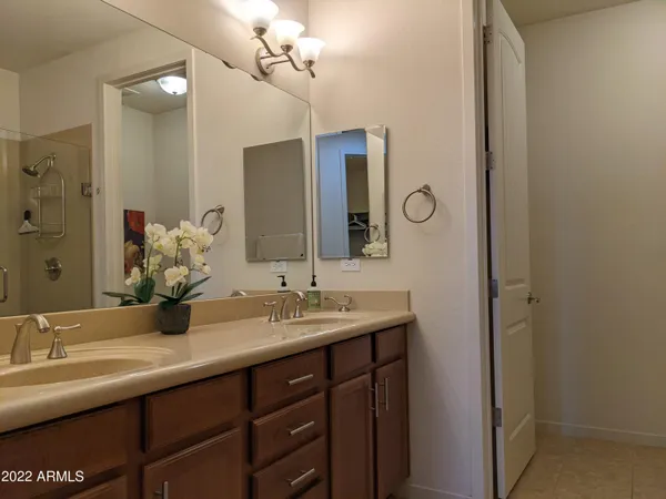 a bathroom with a sink and shower