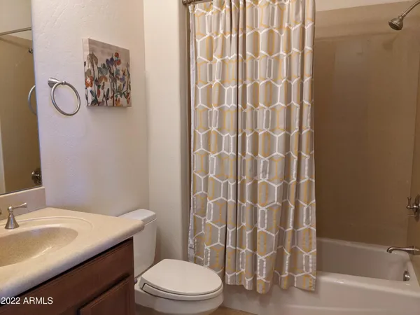 a utility room with sink dryer and washer