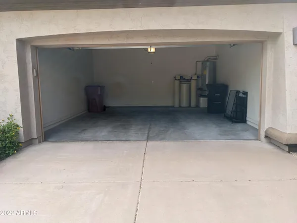 a view of a parking space with cars parked