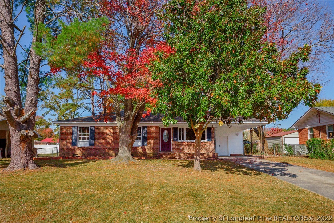 467 North Platte Road Fayetteville, NC 28303 - Photo 2 of 50 a front view of a house with yard tree and outdoor seating