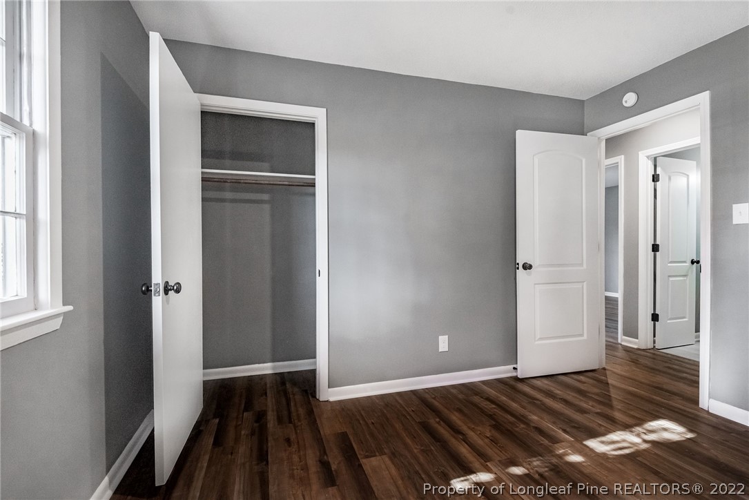 467 North Platte Road Fayetteville, NC 28303 - Photo 23 of 50 a view of an empty room with wooden floor and a window