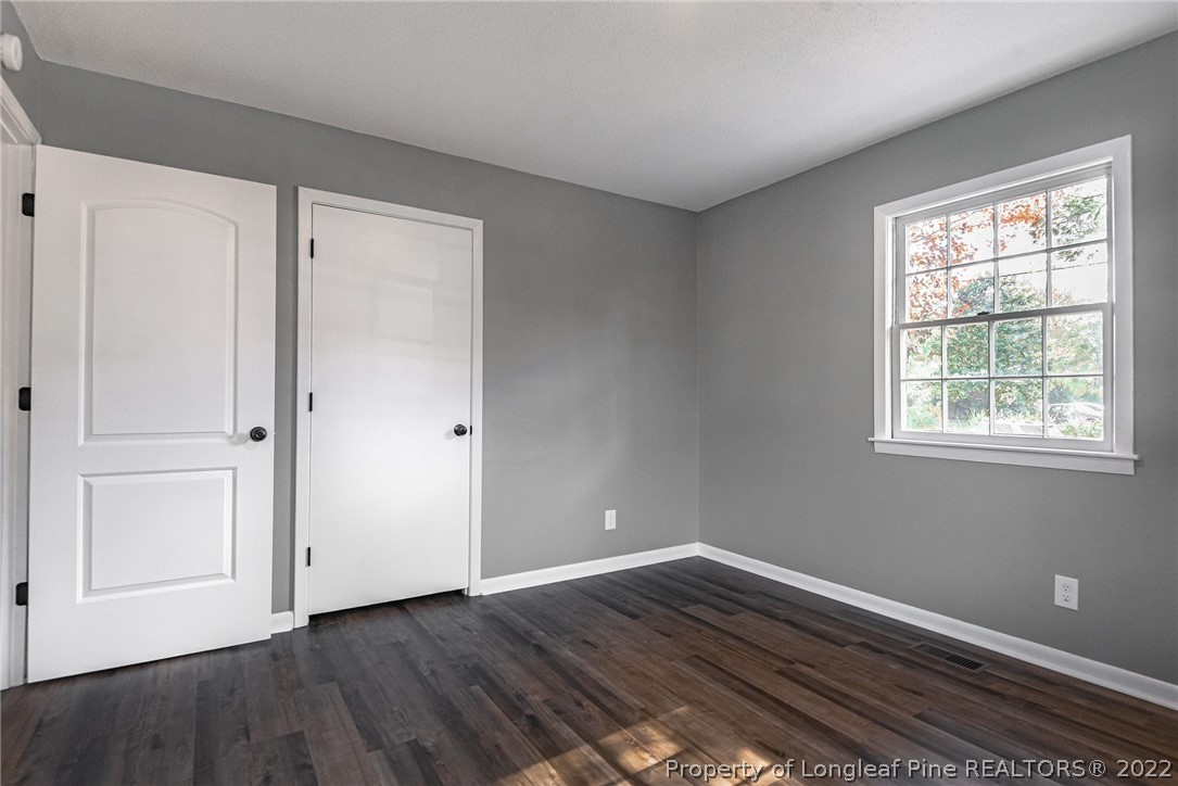 467 North Platte Road Fayetteville, NC 28303 - Photo 26 of 50 a view of an empty room with wooden floor and a window