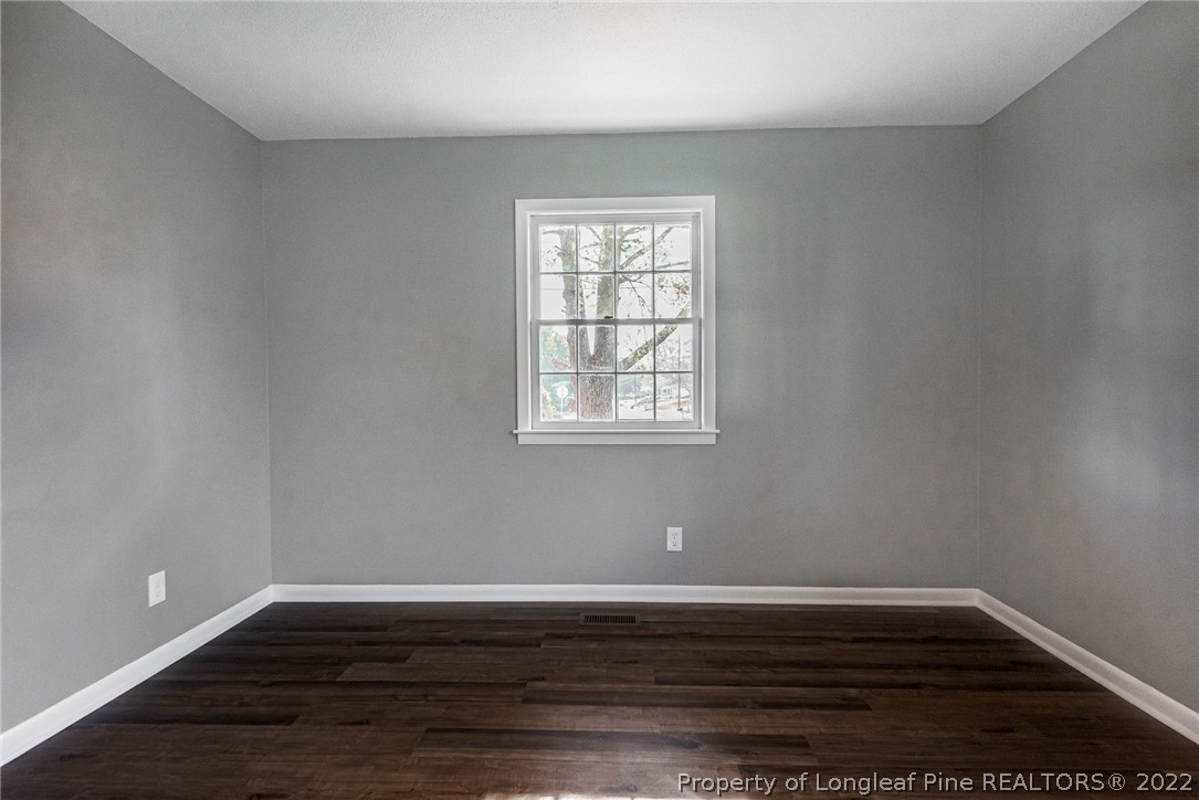467 North Platte Road Fayetteville, NC 28303 - Photo 29 of 50 a view of an empty room with wooden floor and a window