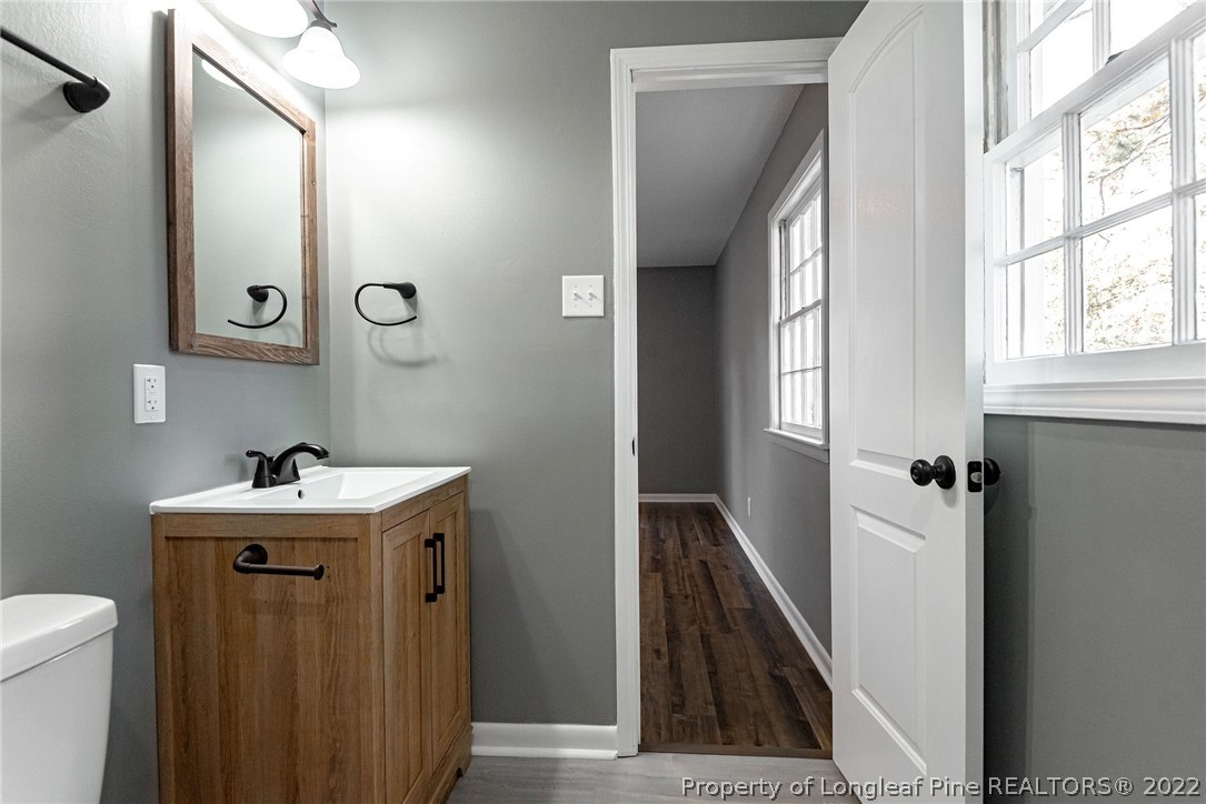 467 North Platte Road Fayetteville, NC 28303 - Photo 32 of 50 a bathroom with a sink and mirror with toilet