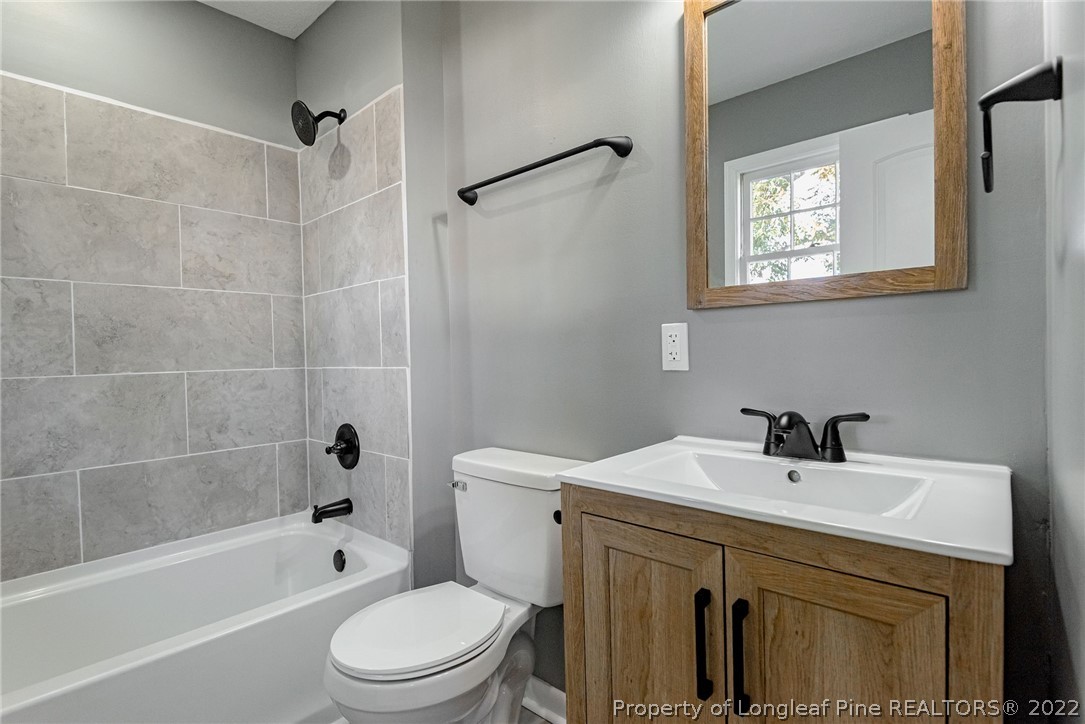 467 North Platte Road Fayetteville, NC 28303 - Photo 33 of 50 a bathroom with a sink a toilet and shower