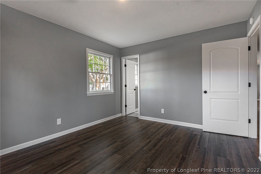 467 North Platte Road Fayetteville, NC 28303 - Photo 38 of 50 a view of an empty room with wooden floor and a window