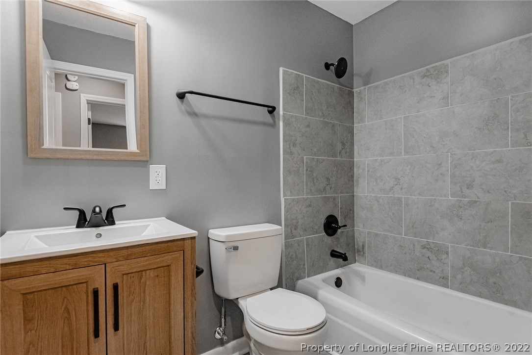 467 North Platte Road Fayetteville, NC 28303 - Photo 43 of 50 a bathroom with a sink toilet a shower and bathtub