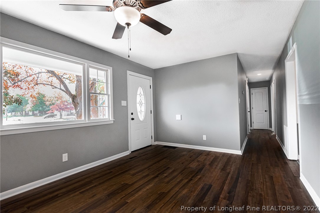 467 North Platte Road Fayetteville, NC 28303 - Photo 7 of 50 a view of an empty room with wooden floor and a window