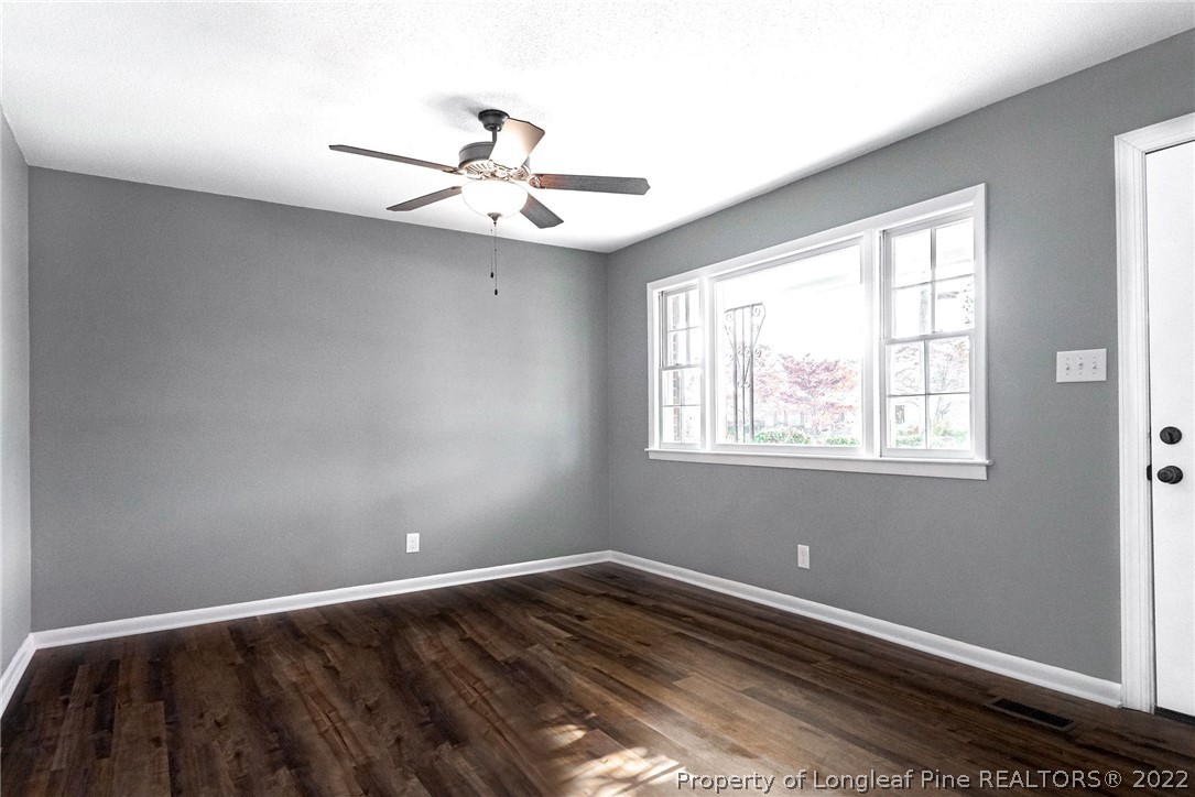 467 North Platte Road Fayetteville, NC 28303 - Photo 8 of 50 a view of an empty room with wooden floor and a window