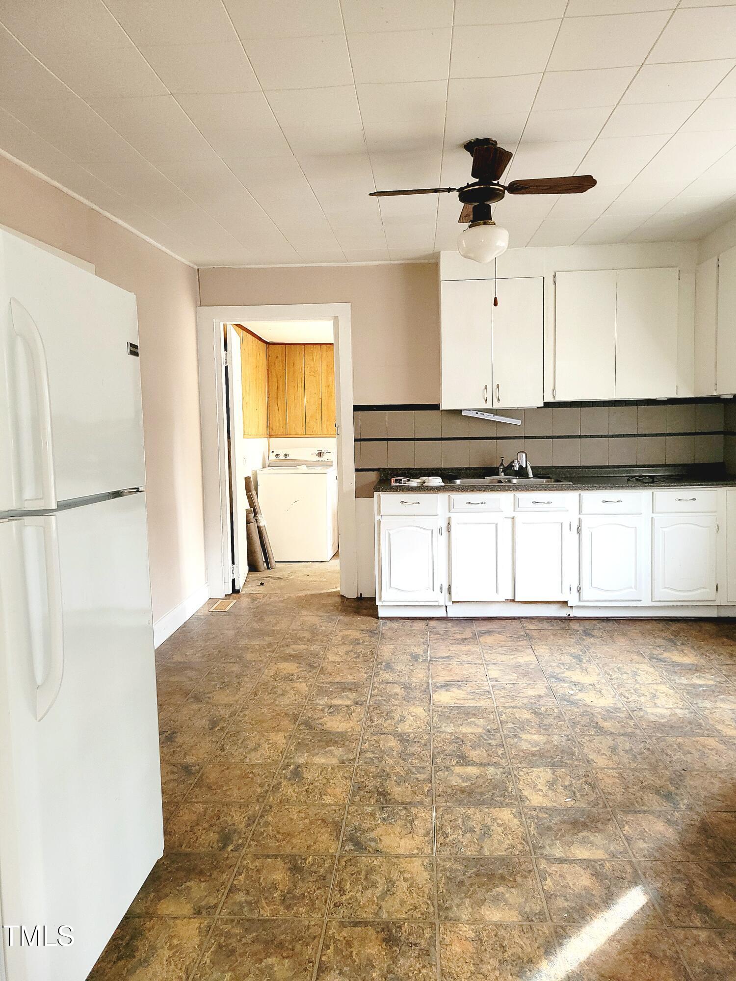 325 Ranch Farm Road, Unit A B Raleigh, NC 27603 - Photo 17 of 36 a view of a kitchen with a sink and a window