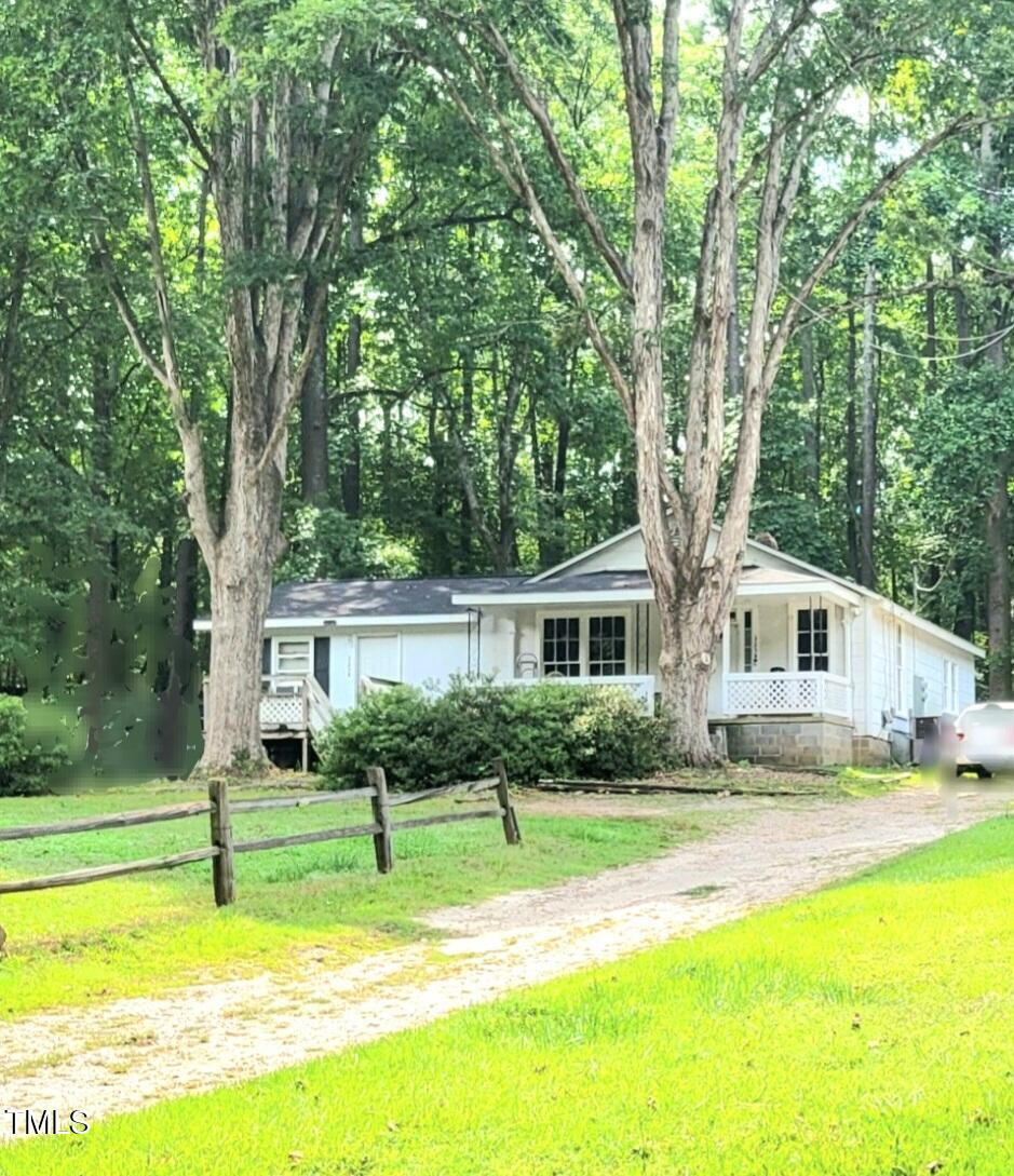 325 Ranch Farm Road, Unit A B Raleigh, NC 27603 - Photo 2 of 36 a view of a house with a swimming pool