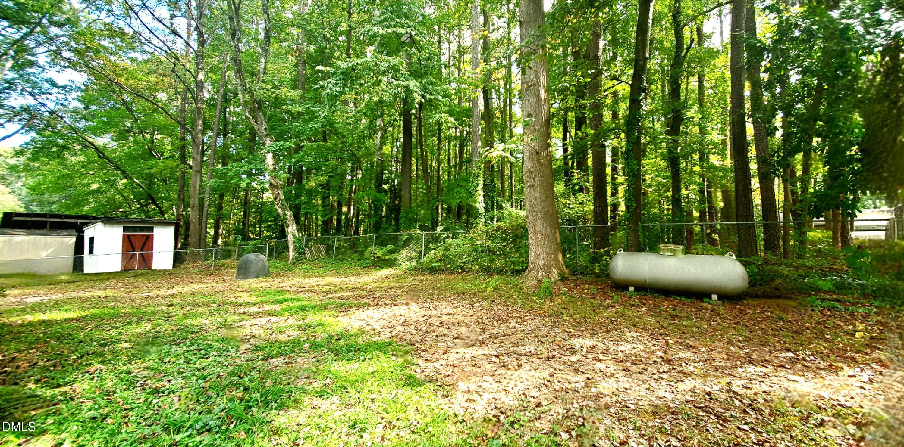 325 Ranch Farm Road, Unit A B Raleigh, NC 27603 - Photo 4 of 36 a view of a backyard with garden