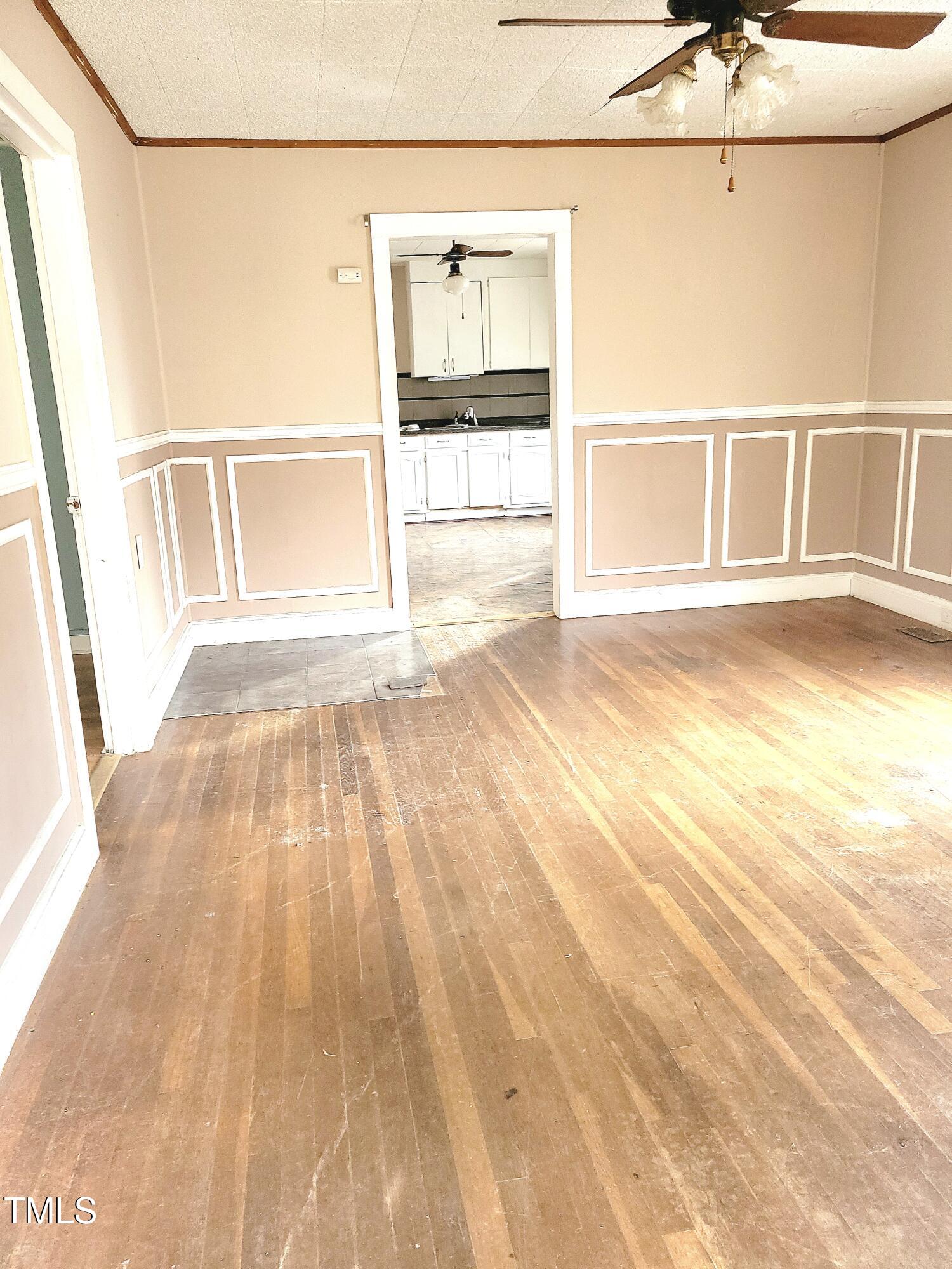 325 Ranch Farm Road, Unit A B Raleigh, NC 27603 - Photo 5 of 36 a view of an empty room with wooden floor