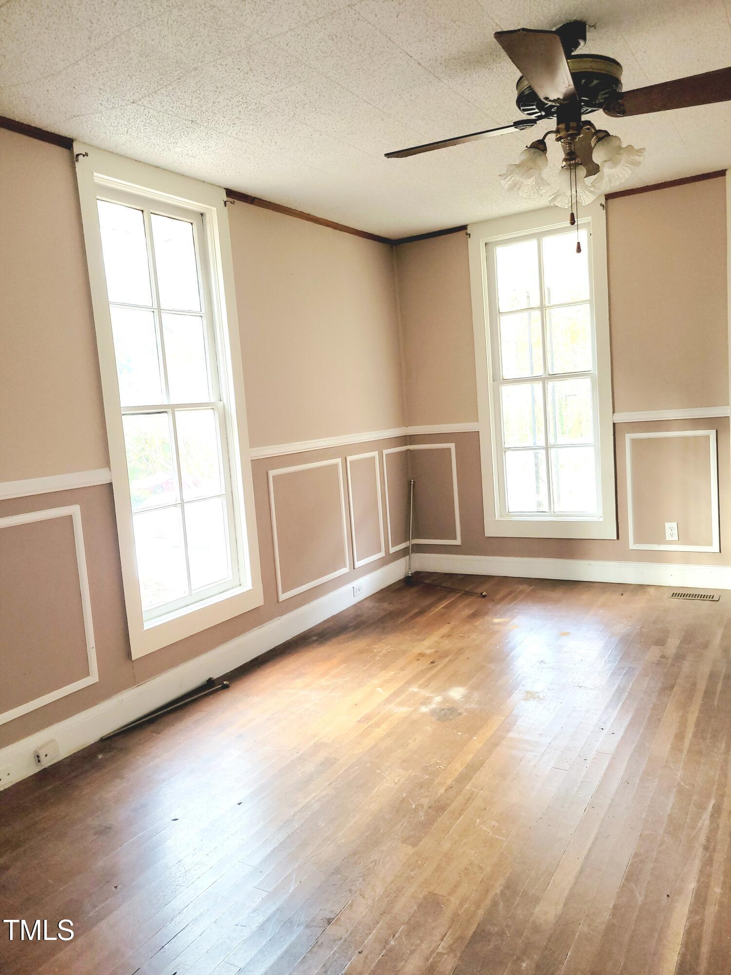 325 Ranch Farm Road, Unit A B Raleigh, NC 27603 - Photo 8 of 36 wooden floor in an empty room with a window