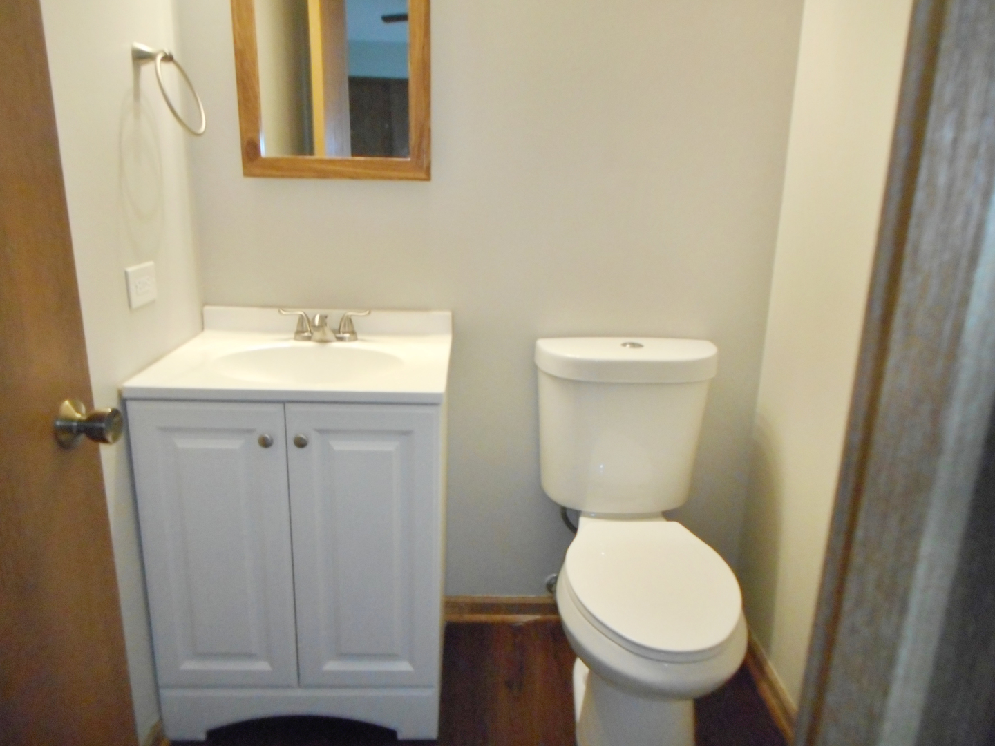 532 Shenandoah Trail Elgin, IL 60123 - Photo 15 of 20 a bathroom with a toilet a sink and wooden floor