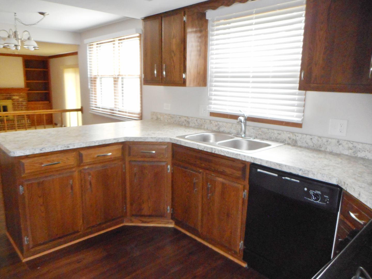 532 Shenandoah Trail Elgin, IL 60123 - Photo 7 of 20 a kitchen with stainless steel appliances granite countertop wooden floors and sink