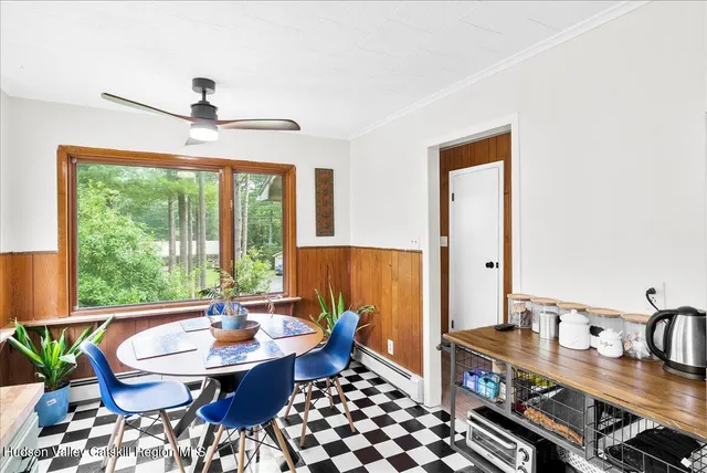 a view of a dining room with furniture window and outside view