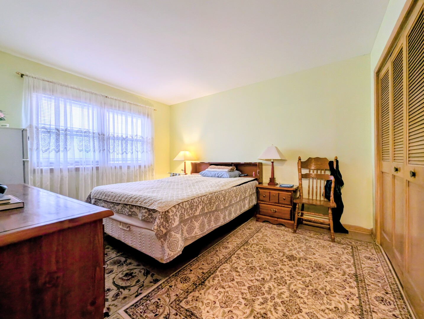 4229 North Keystone Avenue, Unit 3H Chicago, IL 60641 - Photo 16 of 22 a bedroom with a bed and wooden floor