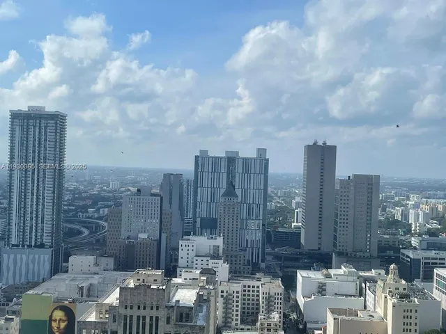 a view of city with tall buildings