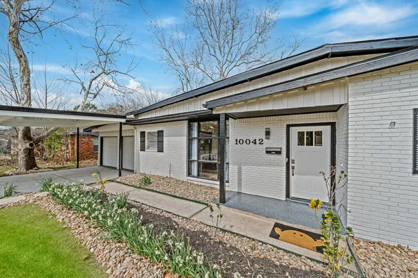 front view of a house with a large window